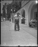 Twelve-year-old Tom Coyle exhibits roping skills, Los Angeles, 1935