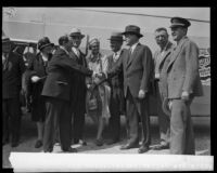 Anthony Fokker shakes hands with James A. Talbot as Mrs. Fokker and others look on, [Montebello?], [1928]