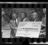 George Deukmejian, Daryl Gates, and Sherman Block with check for Gang Suppression Programs, Calif., 1986