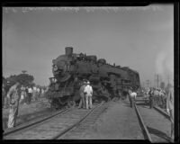 Spectators look on railroad wreckage, Glendale, 1935