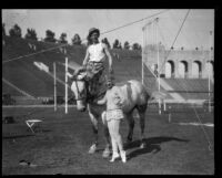 Performers and horse in Shrine Circus, Los Angeles Memorial Coliseum, Los Angeles, 1929