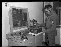 Arizona National Guard sergeant Ernest Mendoza transmitting report by radio, near Parker, Arizona, 1934