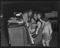 Pianist with Elmer Maiden and chorus girls during a rehearsal for a vaudeville show sponsored by the W.P.A., Los Angeles, 1935