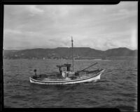 Boat patrols the waters for illegal activity, Newport Beach, 1935