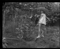 Helene Pirie shovels dirt, Los Angeles, 1926