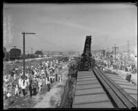 Spectators look on railroad wreckage, Glendale, 1935