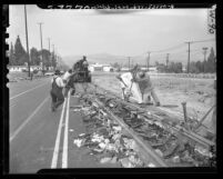 Wrecking crew tearing out streetcar tracks on Vermont Ave. in Los Angeles, Calif., 1948