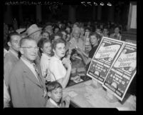 Crowd receiving free tickets for Hollywood Bowl's California Centennial pageant, Los Angeles, 1950