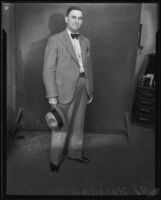 Ed Herman standing with hat, Los Angeles — Calisphere