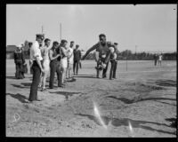 Broad jumper competes during the Pacific Fleet's championship track meet, Long Beach, 1922