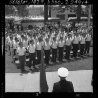 Recruits standing in park being sworn into the U.S. Marines in Los Angeles, Calif., 1964