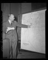 Engineer Jack E. Mauer using map to show his idea of Pomona Freeway route during California Highway Commission hearing