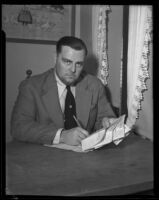 David Hutton holding telegrams, Los Angeles, 1932