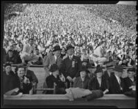 Rufus von KleinSmid enjoys the football game between USC and Notre Dame at the Coliseum, Los Angeles, 1938