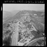 Wildfire burning homes on Chalon Road in Los Angeles, Calif., 1961