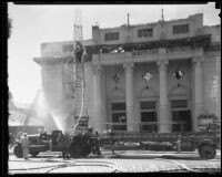 Firefighters attend the fire destroying the First Baptist Church of Hollywood, Hollywood, 1935