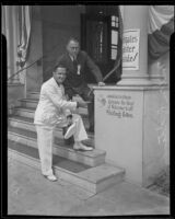 Lorenzo C. Close, with Milton R. Standish, points to his handprint on the Elks Lodge, Santa Monica, 1935