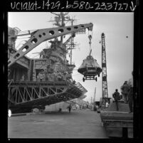 Apollo test capsule being unloaded from the USS Hornet at Long Beach Naval Station, Calif., 1966