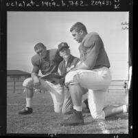 USC football coach John McKay with players Bill Nelson and Mike Bundra, 1961