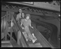 Young adults on a slide at Venice Beach fun house, Los Angeles, 1936