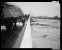 Norwalk bridge spanning the San Gabriel River swollen with rainstorm flooding, [Norwalk?], 1927