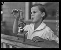 Dick Winslow lights a candle, Los Angeles, 1926