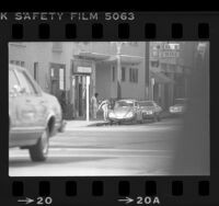 Prostitute speaking to man in automobile on Hollywood Blvd. in Hollywood, Hollywood (Los Angeles), 1977