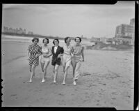 Mrs. John E. Bryant Jr., Edna Hammond, Jean Mills, Mrs. J. Thomas Mahl, and Margaret Kelsey stroll along the beach, Del Mar, 1936