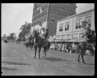 Couple on horseback in the parade for the Old Spanish Days Fiesta, Santa Barbara, 1930