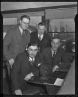 Sheriff Gene Biscailuz tries new radio equipment with Herbert C. Legg, Gordon L. McDonough, and Charles Ellison, Los Angeles, 1936