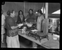 Women cooking tortillas and other food at a relief camp after the flood resulting from the Saint Francis Dam failure, Santa Clara River Valley (Calif.), 1928