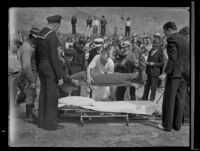 Crowd gathers to watch the removal of Melvin Hoffman's body, Los Angeles, 1936