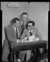 Police detectives sit with Edward Ward, accused of attempting to frame the police commissioner, Los Angeles, 1932