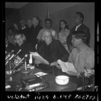 Cesar Chavez, clergy Timothy Manning and Joseph F. Donnelly at press conference announcing grape growers agreement in Calif., 1970