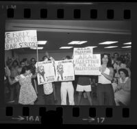 People at Pro-Arab rally with placards reading "Palestine Al-Fateh Revolution Until Victory" and "Arab Palestine For All Palestinians" Los Angeles, Calif., 1973