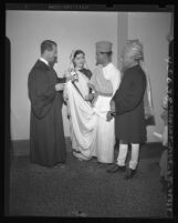 Los Angeles judge Stanley Mosk knotts couple's gowns in Hindu fashion following marriage in 1947