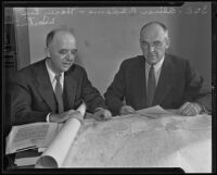 Oliver P. Adams and Harry Lee Martin examine a map for gold dredging, Bakersfield, 2915