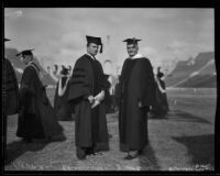 Norman Chandler and Harry Chandler at a graduation ceremony at the Memorial Coliseum, Los Angeles, 1930s
