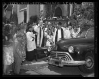 Bishop Ernest Vincent Shayler blessing automobile at St. Thomas Episcopal Church in Los Angeles, Calif., 1946