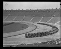 Police vehicles line the interior curve of the track at Los Angeles Memorial Coliseum during an inspection, Los Angeles, 1927