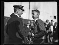 Commander Richard Byrd greets a young man before boarding the C. A ...