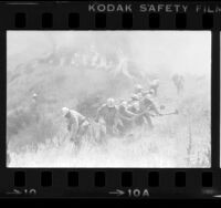 Fire camp crew creating break in wildfire near Newhall, Calif., 1979