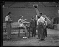 German track star Otto Peltzer talks with some local boys during a training exercise at the Coliseum, Los Angeles, 1928