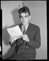 Juan Carlos Zabala holds an entry blank for the Los Angeles Times Marathon, Los Angeles, 1932