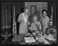 Mrs. John Paton, Mrs. E.R. Capstaff, and Mrs. Frederick Sedding preparing for benefit, 1935