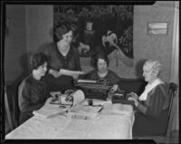 Dorothy Woody, Lillian M. Le Valley, Geraldine Borch, and Isabelle Allen organizing an event for the Women's Auxiliary of the American Legion, Los Angeles, 1935