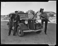 Sheriff R. S. Snedigar and deputies Louis H. Miller and Carl McNew pose with rifles, Victorville, 1935