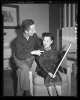 Flora W. Dunn, famed Chinese traditional painter visits with Norman Rockwell, 1949