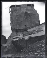 View from below, looking up at center portion of St. Francis Dam that remained after disaster, San Francisquito Canyon (Calif.), 1928