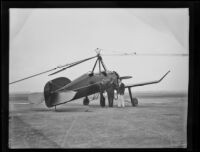 Pilot Johnny Miller stands with 2 unidentified men beside the autogiro, Missing Link, Los Angeles vicinity, 1931